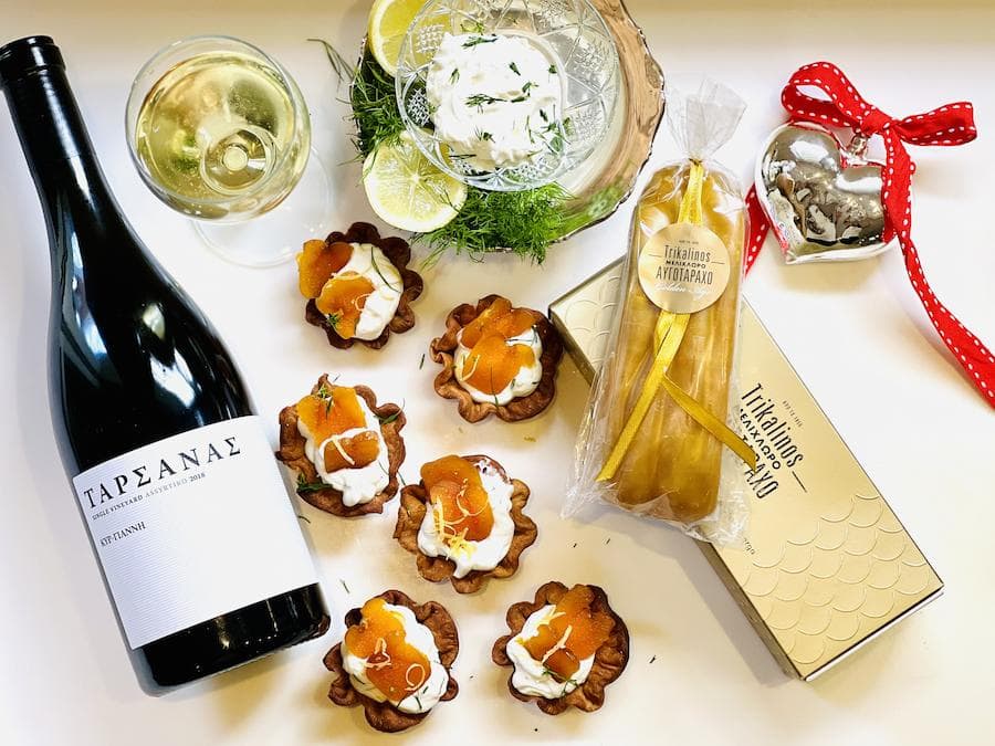 Gourmet Festive Appetizers - Gastronomy Tours tart with cream bottarga a bottle of wine Gastronomy Tours - Gastronomy Tours